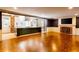 Open concept kitchen and living room with island, stainless appliances, fireplace, and hardwood floors at 3485 Aubusson Trce, Johns Creek, GA 30022