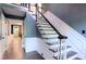 Elegant staircase with hardwood treads, white risers and dark trim is complemented by light blue walls at 3485 Aubusson Trce, Johns Creek, GA 30022