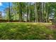 Expansive backyard featuring lush lawns and privacy at 5873 Trellis Ct, Powder Springs, GA 30127