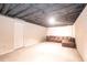Unfinished basement with carpet and a lounge sofa at 5873 Trellis Ct, Powder Springs, GA 30127