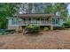 Charming single-story home with a welcoming front porch and well-maintained landscaping at 5873 Trellis Ct, Powder Springs, GA 30127