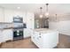 Newly renovated kitchen with white cabinetry, granite countertops, and modern appliances at 5873 Trellis Ct, Powder Springs, GA 30127