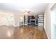 Spacious living room features a decorative fireplace, built-in shelving, and hardwood floors at 5873 Trellis Ct, Powder Springs, GA 30127