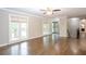 Spacious living room with hardwood floors, neutral paint, and bright windows at 5873 Trellis Ct, Powder Springs, GA 30127