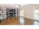 Elegant living room showcasing a fireplace, custom shelving, and large windows at 5873 Trellis Ct, Powder Springs, GA 30127
