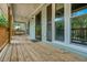 Inviting covered porch with a swing, perfect for enjoying outdoor relaxation at 5873 Trellis Ct, Powder Springs, GA 30127
