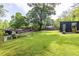 Expansive back yard with patio area and modern outbuilding, perfect for outdoor living and entertaining at 991 Columbia Dr, Decatur, GA 30030