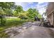 A cozy backyard featuring a patio area with a fire pit and ample greenery at 991 Columbia Dr, Decatur, GA 30030