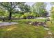 Expansive backyard featuring a modern shed, lush lawn, rock garden, and a charming fire pit area at 991 Columbia Dr, Decatur, GA 30030