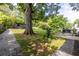 The sprawling backyard includes mature trees, modern shed, gravel walkways, landscaping, and tranquil greenery at 991 Columbia Dr, Decatur, GA 30030