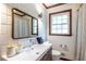 Clean bathroom with updated vanity, modern fixtures, and tiled walls at 991 Columbia Dr, Decatur, GA 30030