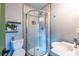 Bathroom showcasing a rounded shower with patterned tile, floating shelves, and a modern sink at 991 Columbia Dr, Decatur, GA 30030