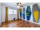 Stylish bedroom with modern geometric accent wall, hardwood floors, and natural light at 991 Columbia Dr, Decatur, GA 30030