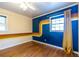 Vibrant bedroom featuring bold accent wall, hardwood floors and lots of natural light at 991 Columbia Dr, Decatur, GA 30030