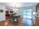 Open concept dining area with modern lighting, hardwood floors, and seamless access to the kitchen at 991 Columbia Dr, Decatur, GA 30030