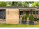 Close-up of house front, wooden address accent and green door at 991 Columbia Dr, Decatur, GA 30030