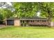 Brick home with updated accents, driveway and green front lawn at 991 Columbia Dr, Decatur, GA 30030