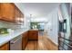 Spacious kitchen with stainless steel appliances and new countertops leads to dining room at 991 Columbia Dr, Decatur, GA 30030