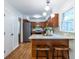 Efficient kitchen with stainless appliances, light countertops, mosaic backsplash and a breakfast bar at 991 Columbia Dr, Decatur, GA 30030