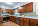 Well-lit kitchen features wooden cabinetry, stainless steel appliances, and a patterned backsplash at 991 Columbia Dr, Decatur, GA 30030