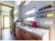 Efficient kitchenette with modern cabinets, granite countertop, stainless sink, and compact appliances at 991 Columbia Dr, Decatur, GA 30030