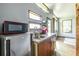 Well-designed kitchenette with stainless steel appliances, wood cabinets, and natural light at 991 Columbia Dr, Decatur, GA 30030