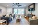 Bright living room with hardwood floors, lots of light, and elegant furnishings at 991 Columbia Dr, Decatur, GA 30030