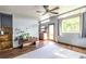 Open-concept living space with lots of light, wood-look flooring, and a seamless flow to kitchen at 991 Columbia Dr, Decatur, GA 30030