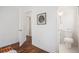 Hallway view of a recently updated bathroom with a toilet, and stylish flooring at 331 Zelma Sw St, Marietta, GA 30060