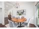 Bright dining area featuring a wooden table, modern chandelier, and sliding glass door at 331 Zelma Sw St, Marietta, GA 30060