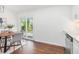 Bright dining area featuring a wooden table, modern chandelier, and sliding glass door at 331 Zelma Sw St, Marietta, GA 30060
