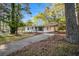 Beautiful home boasts a driveway, covered entryway, and well-maintained front lawn at 331 Zelma Sw St, Marietta, GA 30060