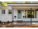 Close up of the covered front porch of the white brick home with a light blue door at 331 Zelma Sw St, Marietta, GA 30060