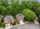 Beautiful brick homes nestled in a lush, green neighborhood with mature trees and well-maintained landscaping at 1143 Brookhaven North Cir, Brookhaven, GA 30319