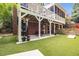 Backyard features manicured lawn, patio, and wooden fence at 1143 Brookhaven North Cir, Brookhaven, GA 30319