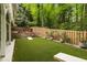 Backyard features manicured lawn, patio, and wooden fence at 1143 Brookhaven North Cir, Brookhaven, GA 30319