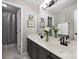 Bathroom featuring double sinks, granite countertops and decorative fixtures at 1143 Brookhaven North Cir, Brookhaven, GA 30319