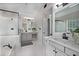 Bathroom featuring double sinks, and a tub with a shower and dark fixtures at 1143 Brookhaven North Cir, Brookhaven, GA 30319
