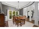Bright dining room with coffered ceilings, with view to staircase and front door at 1143 Brookhaven North Cir, Brookhaven, GA 30319