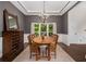 A lovely dining area featuring an attractive chandelier, and a view to a verdant front yard at 1143 Brookhaven North Cir, Brookhaven, GA 30319