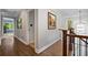 Upstairs hallway with hardwood floors and decorative light fixture at 1143 Brookhaven North Cir, Brookhaven, GA 30319