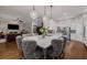 Open kitchen featuring a large center island and adjacent to living room with fireplace at 1143 Brookhaven North Cir, Brookhaven, GA 30319
