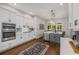 Modern kitchen with stainless steel appliances, gas range, and a cozy breakfast nook at 1143 Brookhaven North Cir, Brookhaven, GA 30319