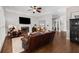 Inviting living room with fireplace and dark hardwood floors leading to the staircase at 1143 Brookhaven North Cir, Brookhaven, GA 30319