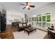 Spacious living room with hardwood floors and plentiful natural light with direct view to the kitchen at 1143 Brookhaven North Cir, Brookhaven, GA 30319