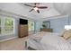 Spacious bedroom with large windows, tray ceiling, and ceiling fan at 1143 Brookhaven North Cir, Brookhaven, GA 30319