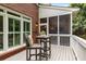 Charming outdoor porch with a wooden table and chairs, perfect for relaxing outdoors at 1143 Brookhaven North Cir, Brookhaven, GA 30319
