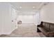 Spacious finished basement with neutral carpet, a wooden bench, recessed lighting, and white walls at 1658 East Clifton Rd, Atlanta, GA 30307