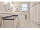 Bathroom features tiled floors, vanity, framed mirrors, and a shower/tub combo at 1658 East Clifton Rd, Atlanta, GA 30307