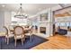 Elegant dining room with a fireplace, modern chandelier, and open layout at 1658 East Clifton Rd, Atlanta, GA 30307